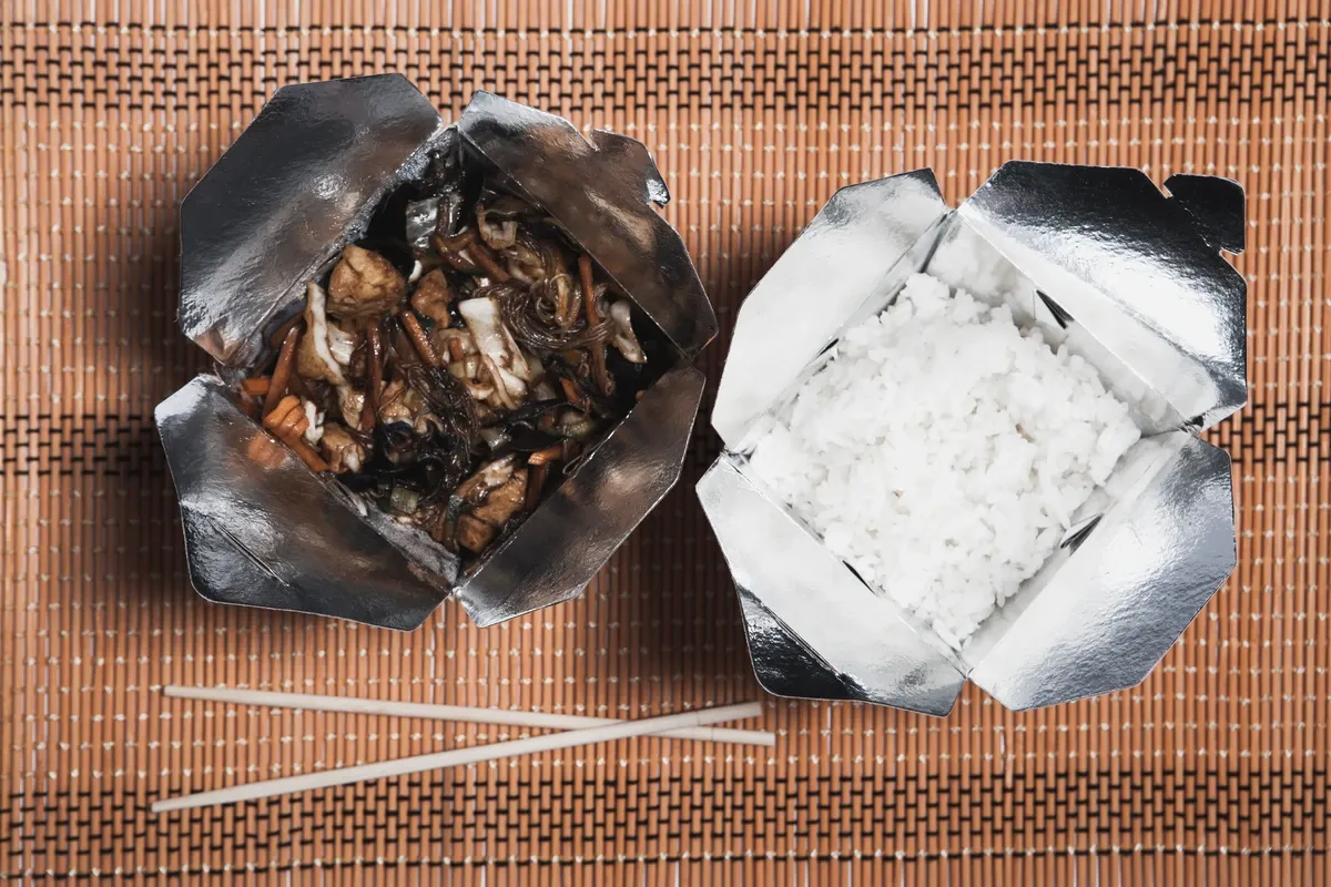 chopsticks-near-boxes-with-chinese-food.webp
