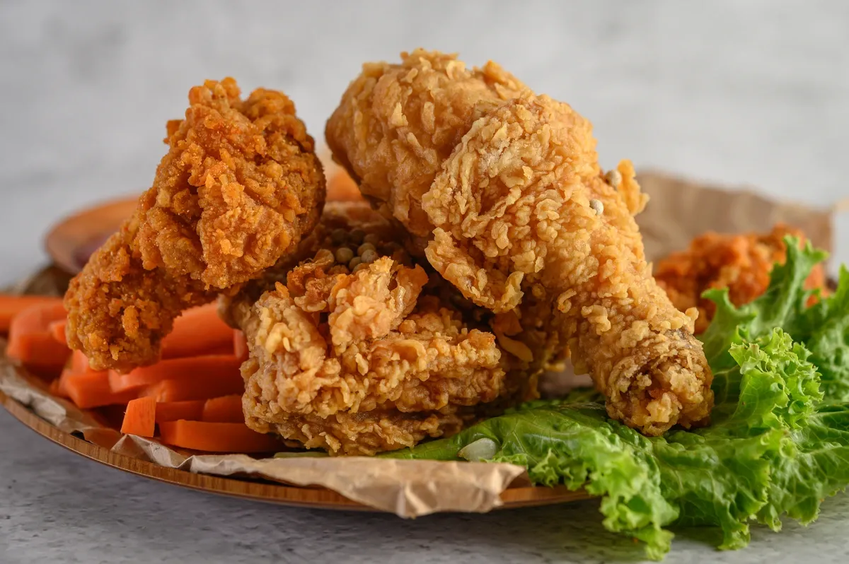 crispy-fried-chicken-plate-with-salad-carrot.webp